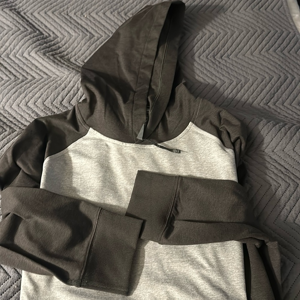 Men's Vuori hooded sweatshirt.    Grey and dark grey.   Size L.
